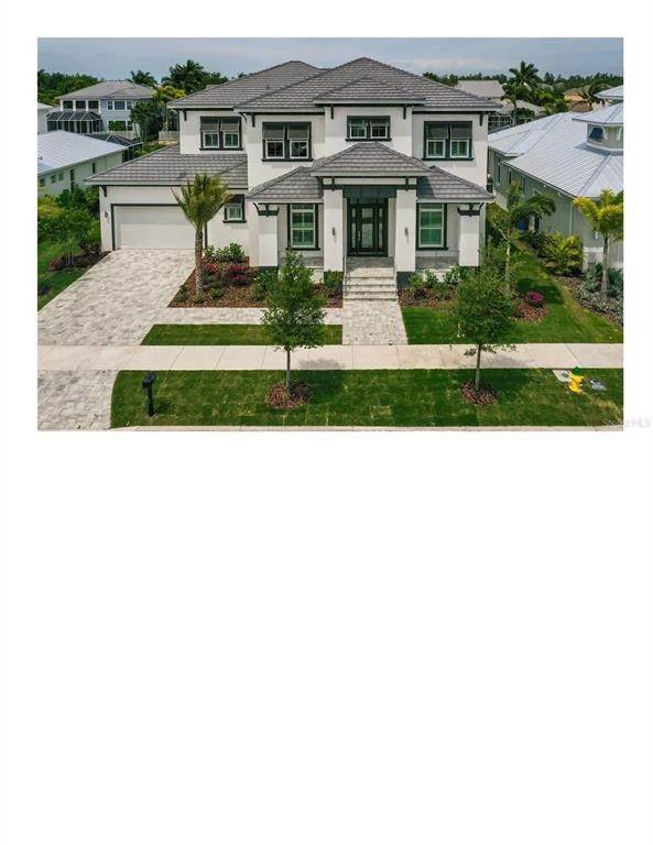 Single Family Homes for Sale at 1013 SYMPHONY ISLES BOULEVARD 1013 SYMPHONY ISLES BOULEVARD Apollo Beach, Florida 33572 United States